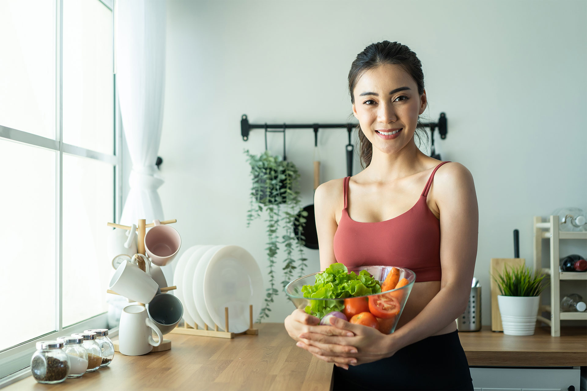 asian-attractive-sport-woman-holding-salad-bowl-an-2021-12-09-15-16-10-XJ3SGYZ.jpg